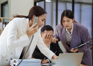 Frustrated business team struggling with disconnected communication systems before unified customer engagement.
